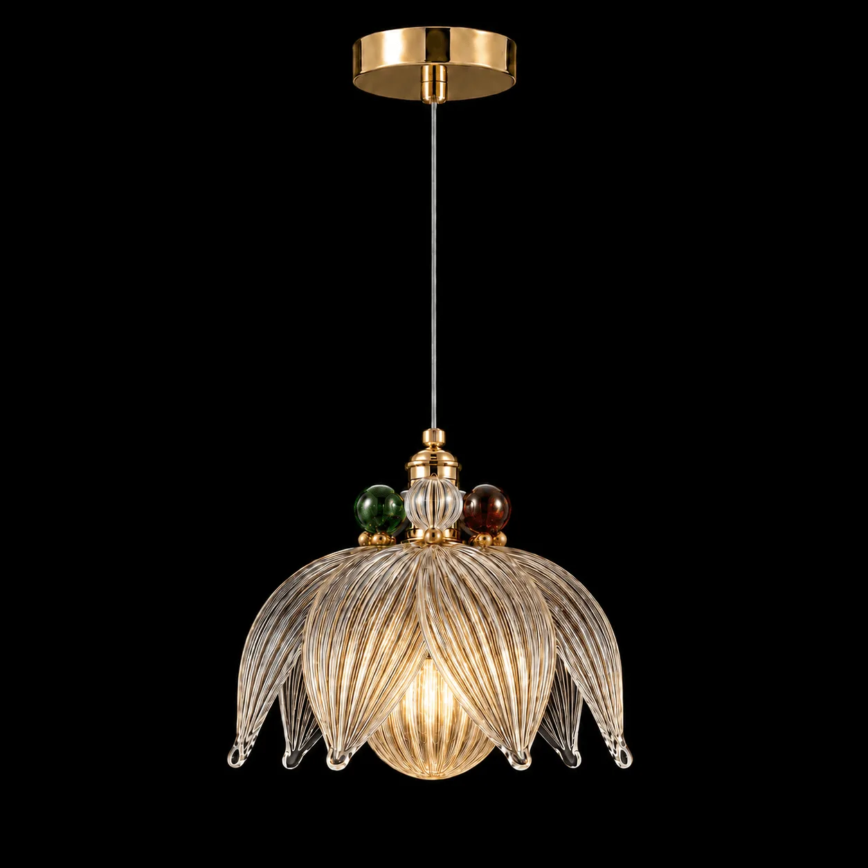 Glass Petal Pendant Light — Ribbed Flower Shade with Coloured Orb Collar 2 Glass petal pendant light on black background lit — ribbed flower-form shade with eight curling glass petals, emerald green and ruby red orbs at collar, warm E27 filament glow