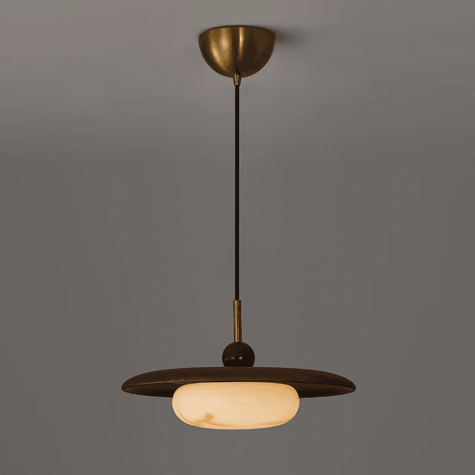 Wood and Alabaster Pendant Light – Teak Disc & Glowing Stone 35 cm | Jagmag Lights 2 Teak and alabaster pendant light lit warm against a dark wall – Jagmag Lights