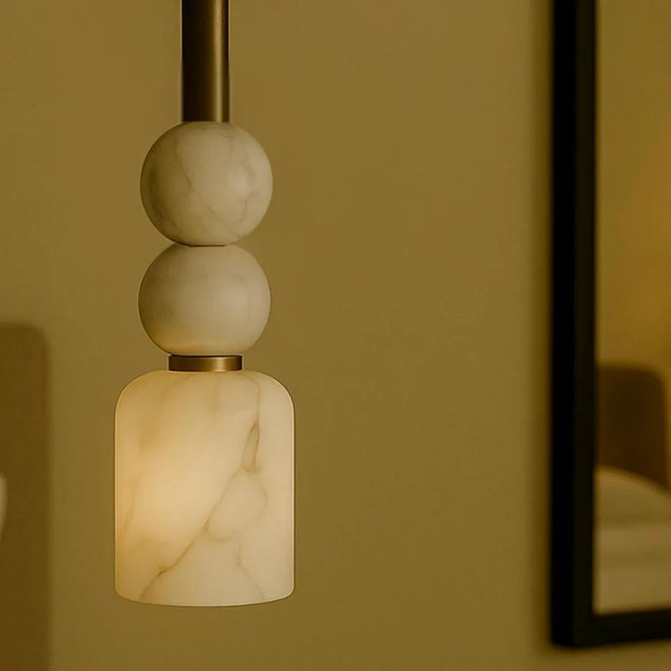 Alabaster Beaded Pendant Light – 44 cm Brass Stem | Jagmag Lights 3 Close-up of the alabaster cylinder shade showing natural veining lit from within