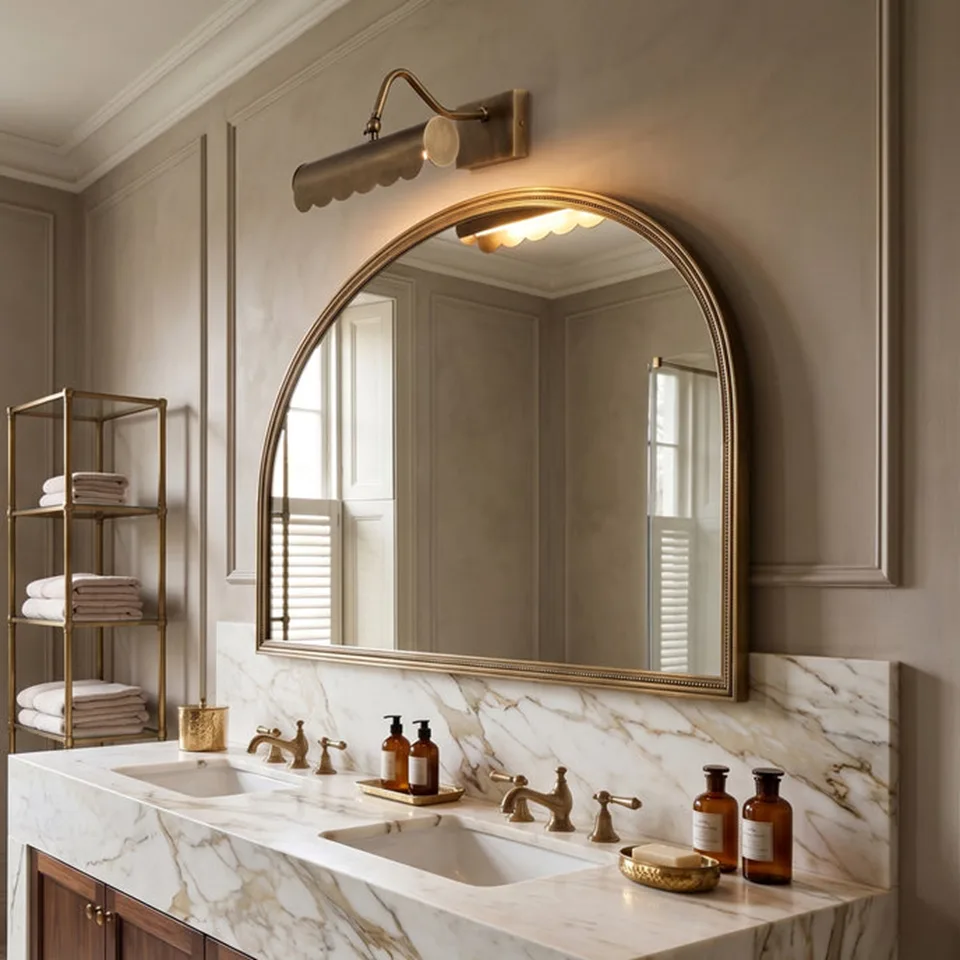 Brass Mirror Light – Scalloped Picture Light, Antique Finish | Jagmag Lights 2 Brass mirror light above an arched bathroom vanity mirror over a marble washstand