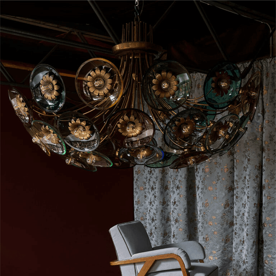 Coloured Glass Chandelier – 4 ft Brass Bowl with 6″ Glass Discs | Jagmag Lights 4 Coloured glass chandelier hung in a dark panelled room above an armchair