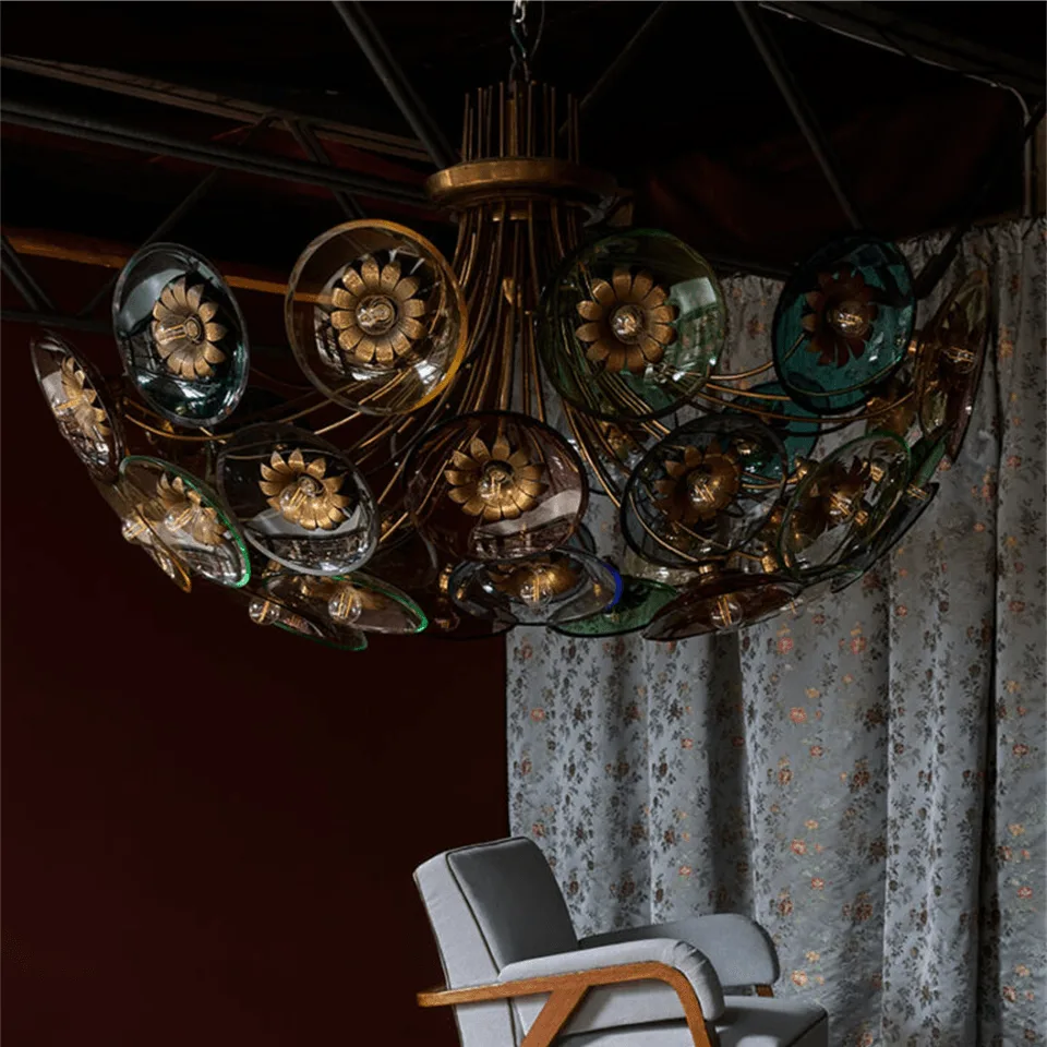 Coloured Glass Chandelier – 4 ft Brass Bowl with 6″ Glass Discs 4 Coloured glass chandelier hung in a dark panelled room above an armchair