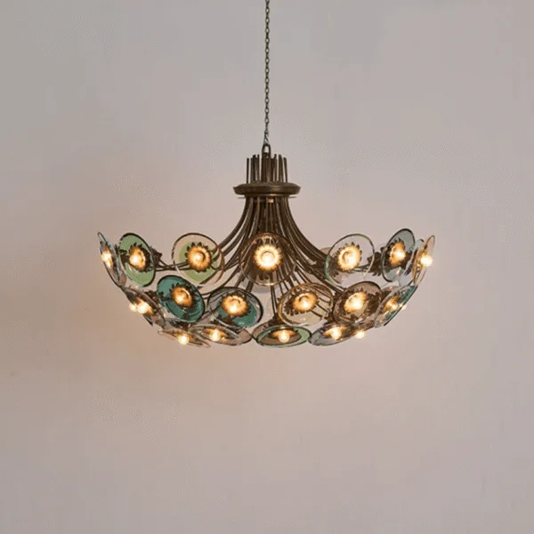Coloured glass chandelier lit, 28 glass discs glowing in green, blue and amethyst