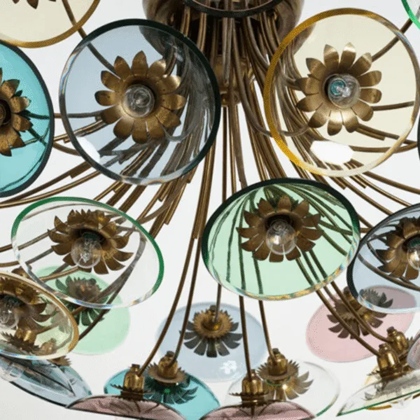 Underside of the coloured glass chandelier showing the brass arms and glass discs