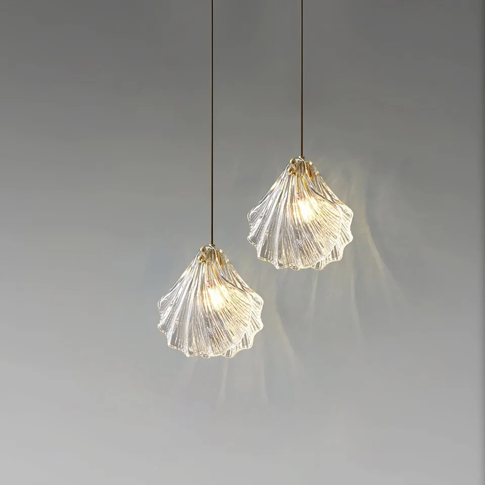 Glass Leaf Pendant Light – Clear Ribbed Glass with Brass, G9 6 Two glass leaf pendant lights hung at staggered heights and lit warm white
