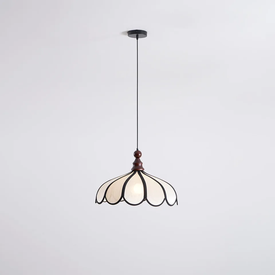 Scalloped Fabric Pendant Light – Ivory Petals, Black Trim and Wood Finial, 50 cm 3 Scalloped fabric pendant light switched on, the ivory fabric glowing warm under a matte black ceiling canopy