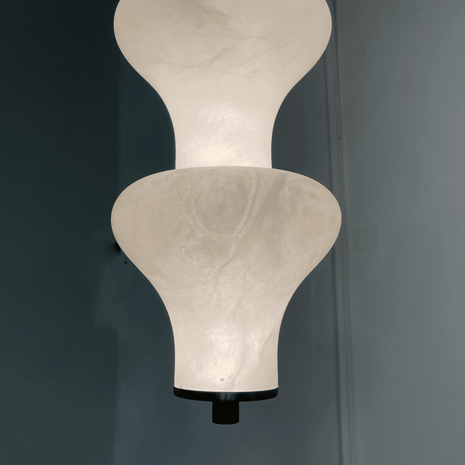Sculptural Alabaster Pendant Light – 65 cm Stacked Stone | Jagmag Lights 4 Close-up of alabaster veining lit from within against a teal wall