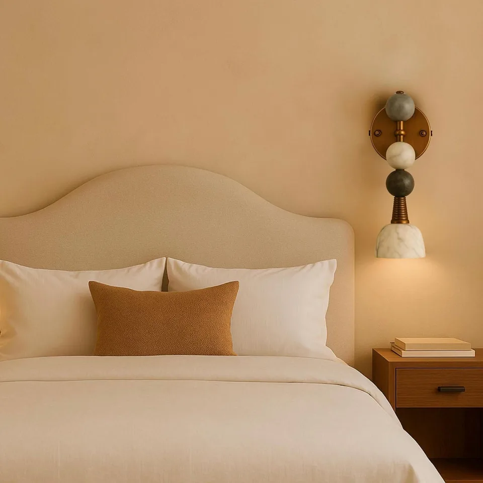 Stone Bead Wall Light – 18″ Stacked Alabaster Sconce | Jagmag Lights 2 Stone bead wall light lit beside a bed, warm light falling onto the nightstand