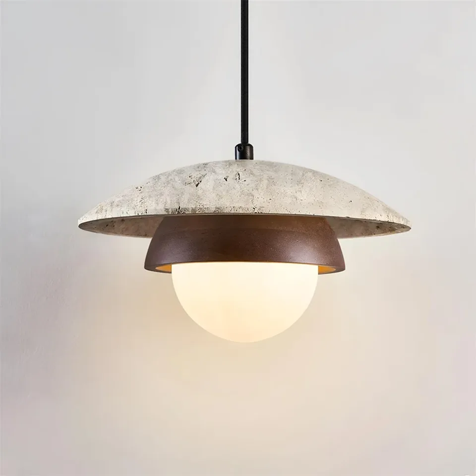 Travertine Saucer Pendant Light – Stone Disc, Rust Collar & Opal Globe, 25 cm | Jagmag Lights 3 Travertine saucer pendant light lit, opal globe glowing warm below the stone disc - Jagmag Lights