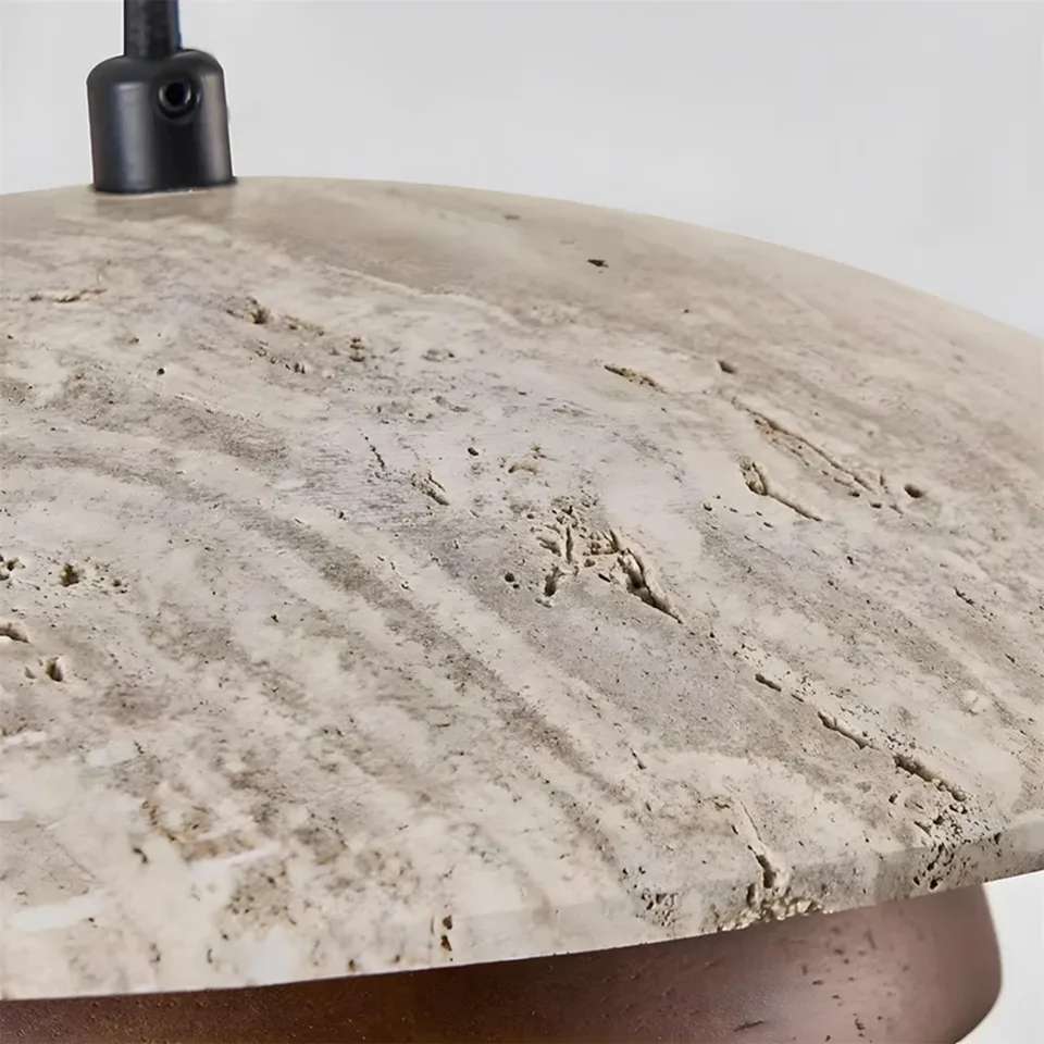 Travertine Saucer Pendant Light – Stone Disc, Rust Collar & Opal Globe, 25 cm | Jagmag Lights 5 Close-up of the pitted travertine stone surface on a saucer pendant light - Jagmag Lights