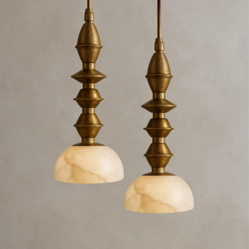 Turned Brass Pendant Light – 16″ Alabaster Dome | Jagmag Lights 3 Two turned brass pendant lights hung at staggered heights against plaster