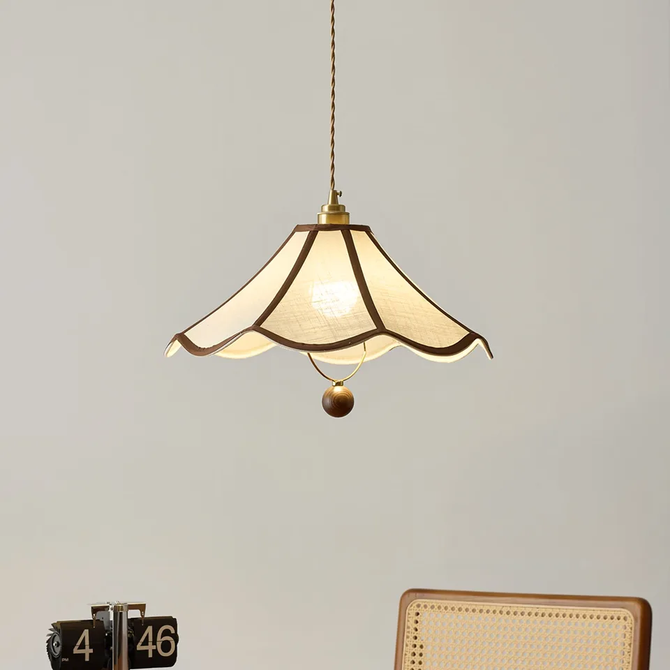 Umbrella Fabric Pendant Light – Wavy Shade, Brown Trim & Wood Ball Drop, 40 cm | Jagmag Lights 8 Umbrella fabric pendant light lit above a desk with a cane chair - Jagmag Lights