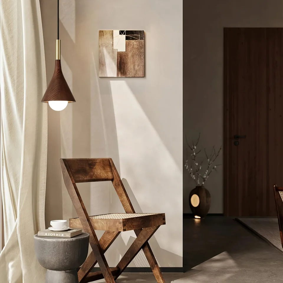 Wood Cone Pendant Light – Teak Shade, Brass Stem & Opal Glass Globe 10 Inch | Jagmag Lights 12 Wood cone pendant light over a chair in a warm reading corner - Jagmag Lights
