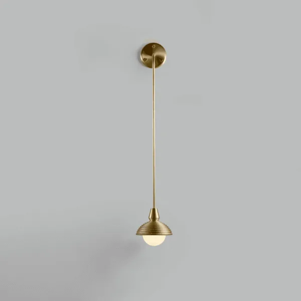 Front view of the hanging wall light, its long 90 cm stainless steel arm in brushed brass finish ending in a reeded wood dome and opal borosilicate glass ball