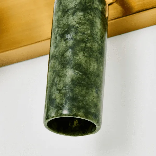 Close-up of the hollow green jade stone cylinder of the green wall light, showing its natural veining