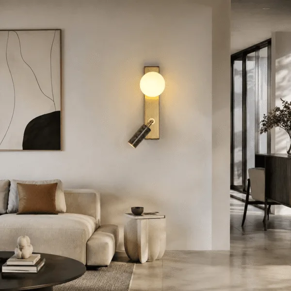 Green wall light mounted upright on a living room wall above a side table, opal globe lit and jade cylinder angled down