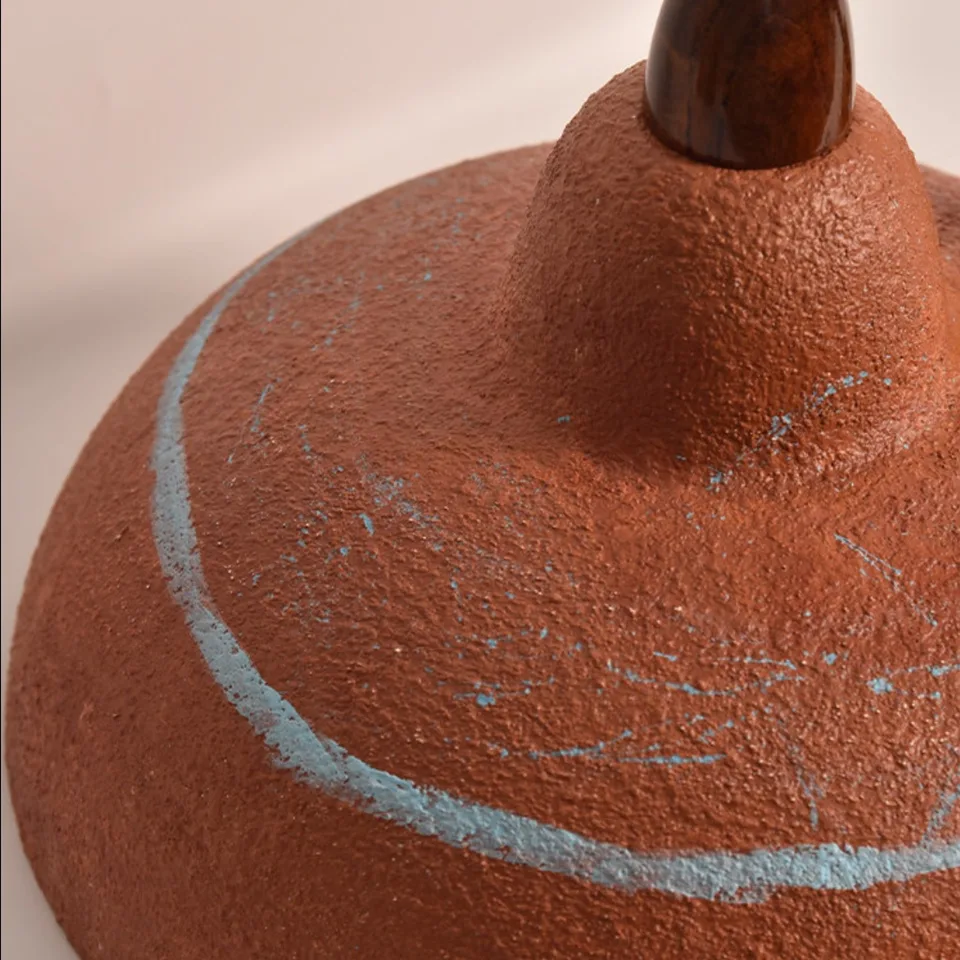 Terracotta Resin Pendant Light – Hand-Painted Dome, 35 cm | Jagmag Lights 10 Close-up of the wood finial and textured terracotta top of the resin pendant with hand-painted blue-green accent