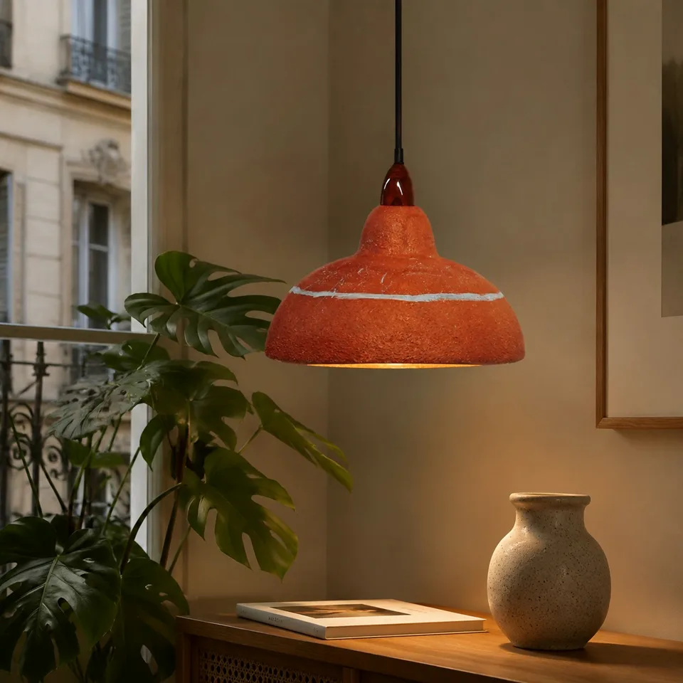 Terracotta Resin Pendant Light – Hand-Painted Dome, 35 cm | Jagmag Lights 6 Terracotta resin pendant light lit warm beside a window with a monstera plant