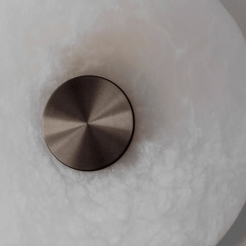 Alabaster Wall Light – Eclipse Disc Sconce, 4 Sizes | JagMag Lights 4 Close-up of the brushed bronze centre cap and natural alabaster veining on the Eclipse disc wall light