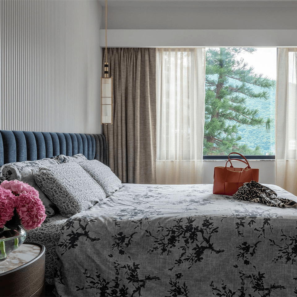 Reeded Glass Lantern Pendant – Brass Cage, 75 cm | Jagmag Lights 4 Satin-brass reeded glass lantern pendant beside a bed by a window
