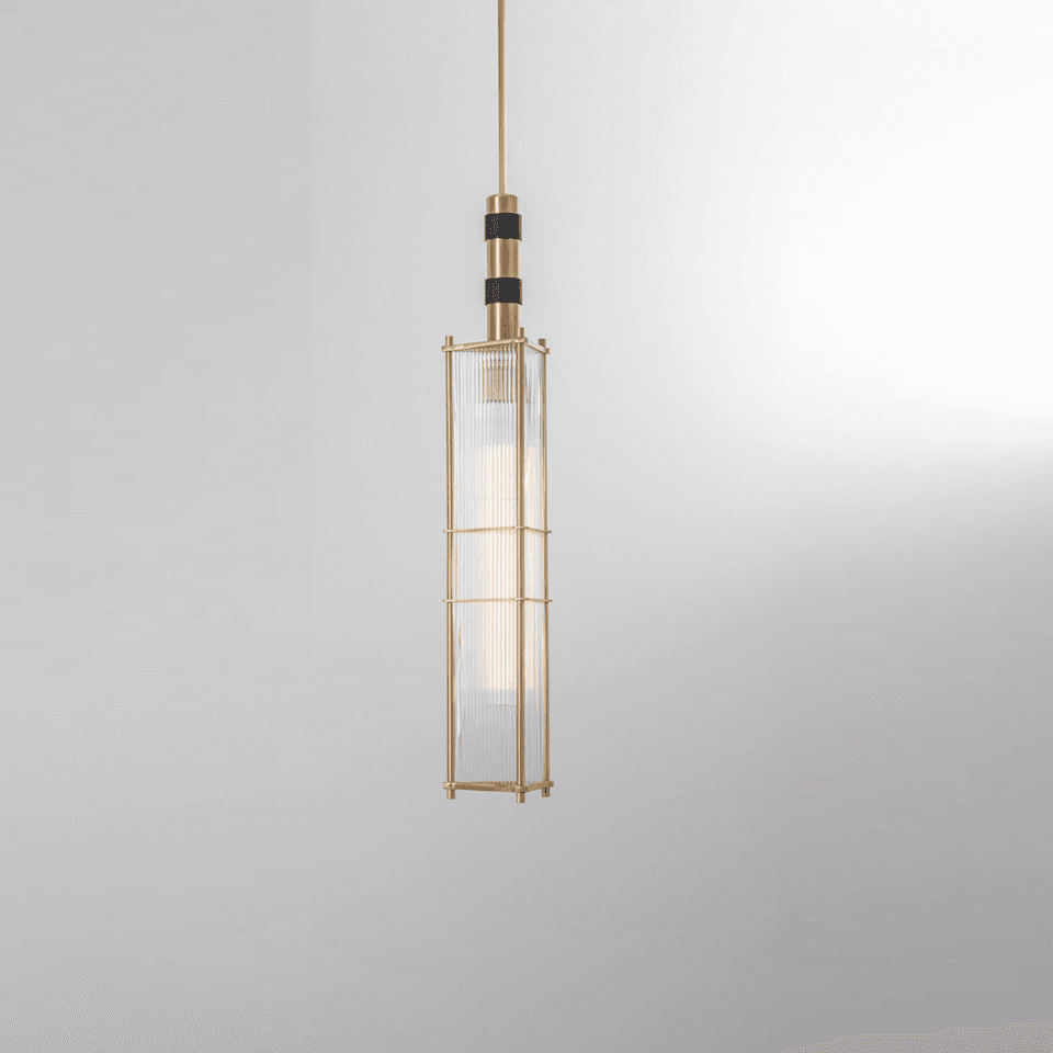 Reeded glass lantern pendant in satin brass with black accent bands, tall rectangular cage of fluted glass