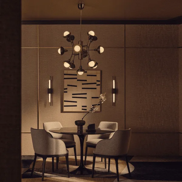 Antique-bronze sputnik chandelier over a round dining table in a warm modern dining room