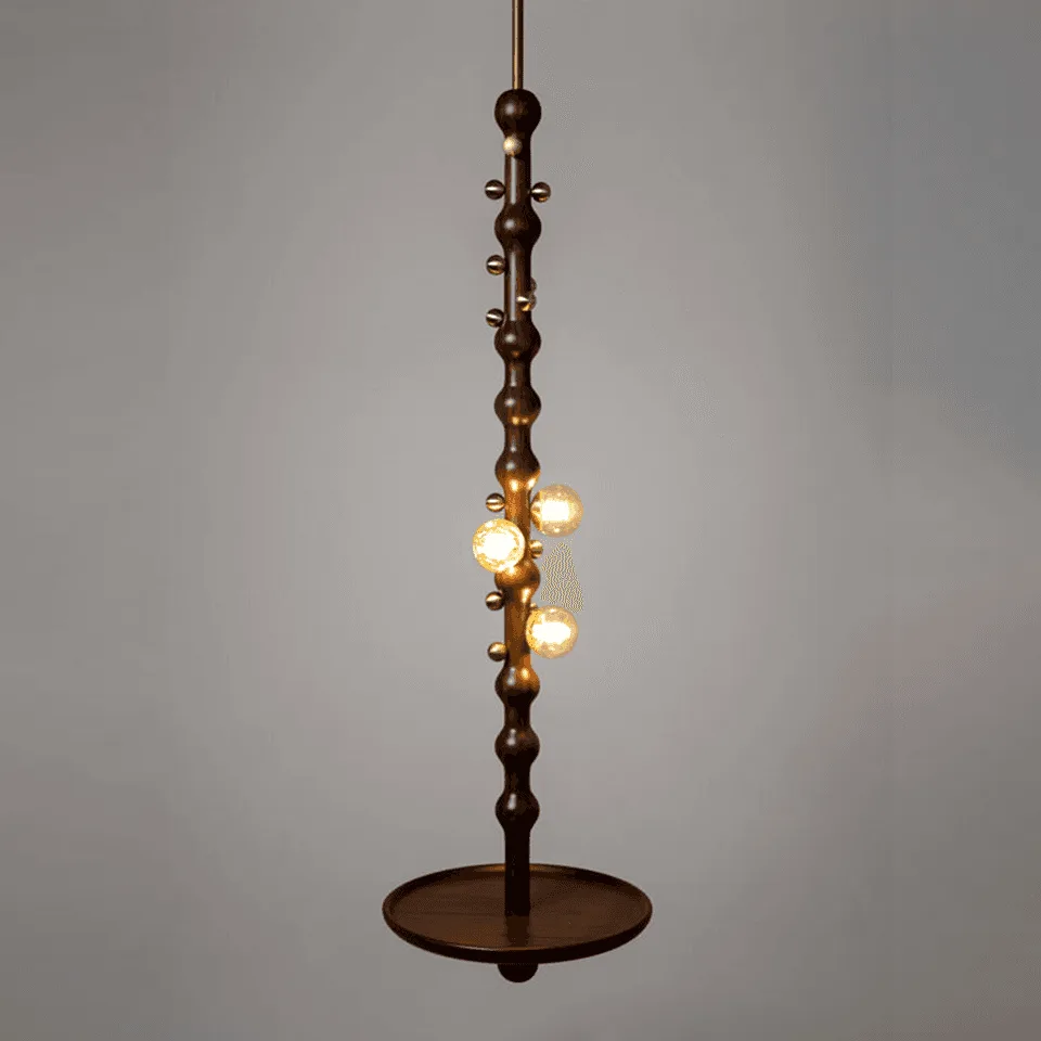 Stem Pendant Light – Sculpted Reclaimed Teak with Amber Glass Globes & Side Table | Jagmag Lights 2 Stem pendant light lit, showing three amber blown-glass globes glowing warm against the teak stem