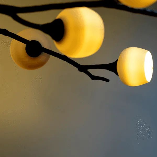 Close-up of opal borosilicate glass cups mounted on forks of the blackened metal branch