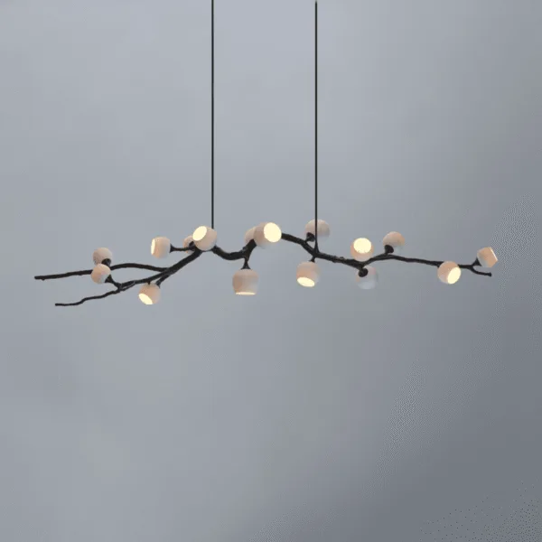 Twig chandelier lit, blackened branch carrying opal borosilicate glass cups at varied angles