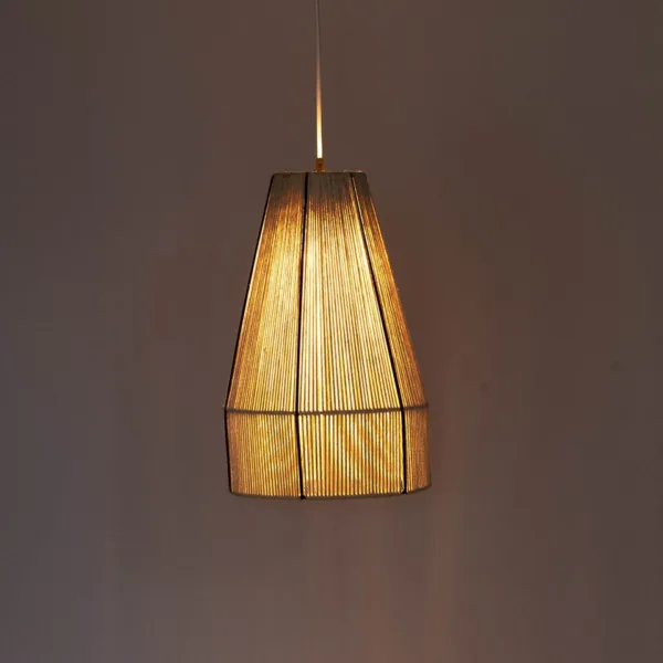 Boho pendant light in hand-wound cream raffia, lit warm against a dark wall, black ribs on the cone