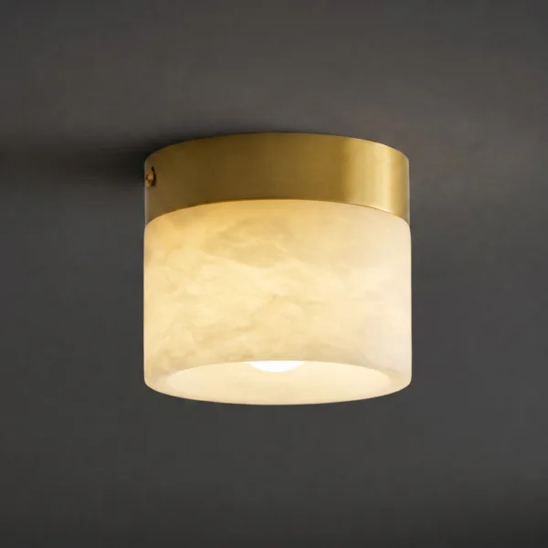 Lit alabaster cylinder ceiling light against a dark ceiling