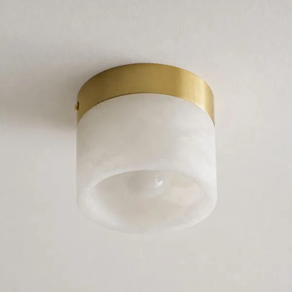 Underside of the alabaster cylinder ceiling light showing the LED