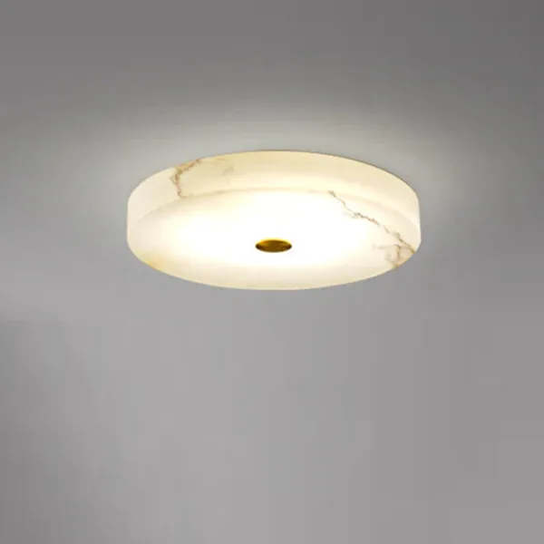 Round alabaster ceiling light lit in cool white on a grey ceiling
