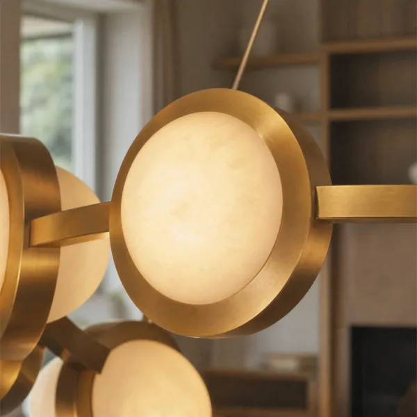 Lit alabaster disc in a brushed brass rim, close-up