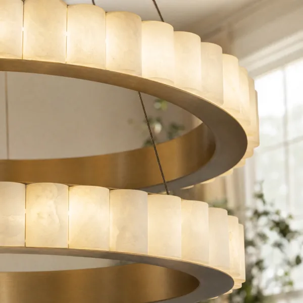 Lit alabaster cylinders on the brass rings, close-up