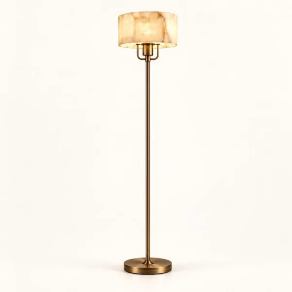 Alabaster drum floor lamp with brass-finish stem on a white background