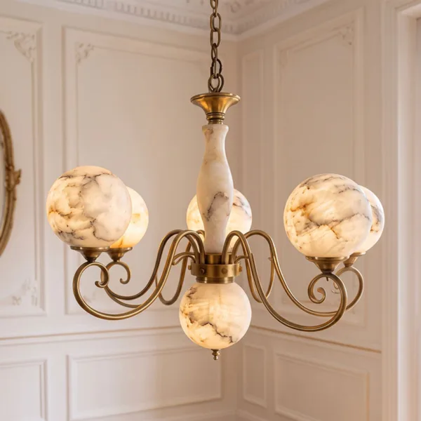 Lit alabaster globe chandelier hanging in a cream panelled room