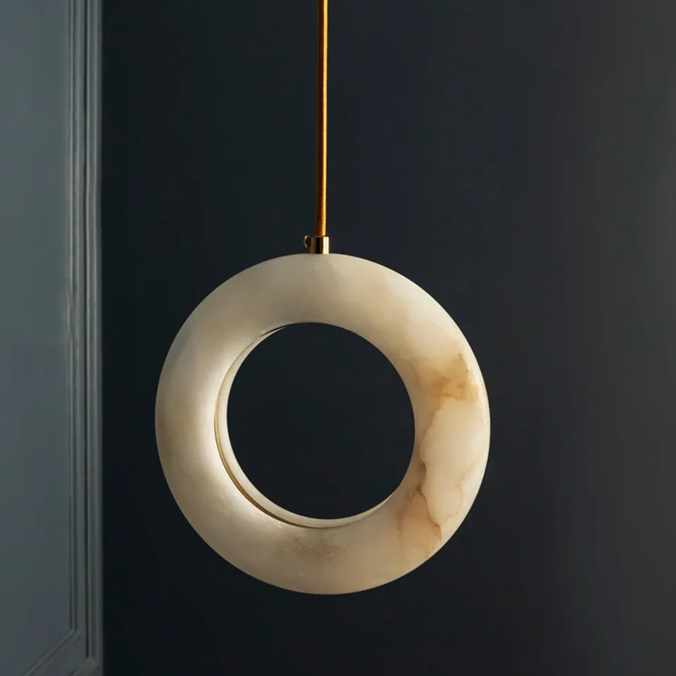 Natural Alabaster Halo Ring Pendant Light – White Stone, 12W LED 3000K, 20 cm | Jagmag Lights 7 Alabaster halo ring pendant light with warm honey veining against a dark navy wall