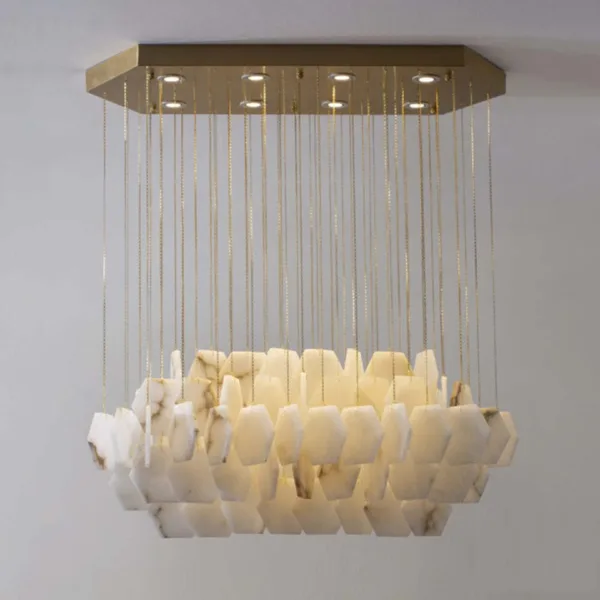 Rectangular alabaster hexagon chandelier lit, layered hexagon tiles on brass chains