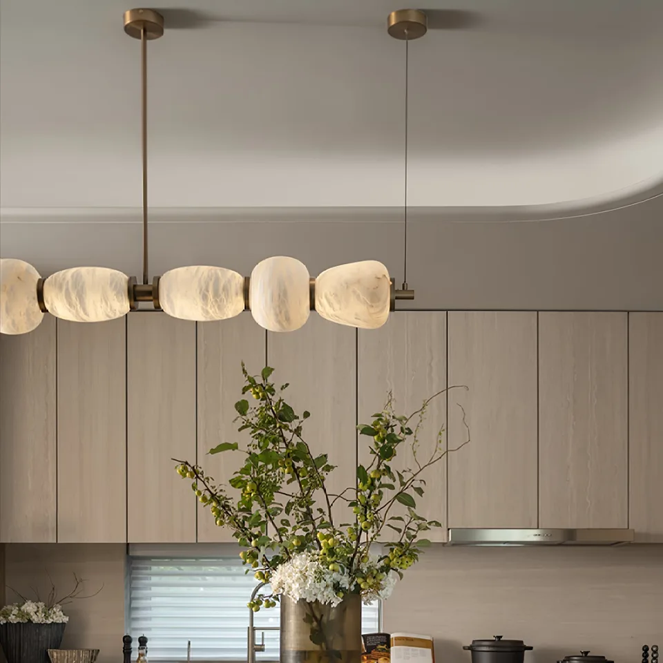 Alabaster Kitchen Island Chandelier 6 Lit alabaster shades and brass bar of the kitchen island chandelier