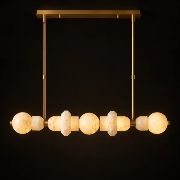 Alabaster orb linear chandelier glowing warm on a black backdrop