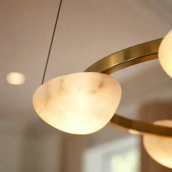 Lit alabaster pebble on the ring chandelier, close-up
