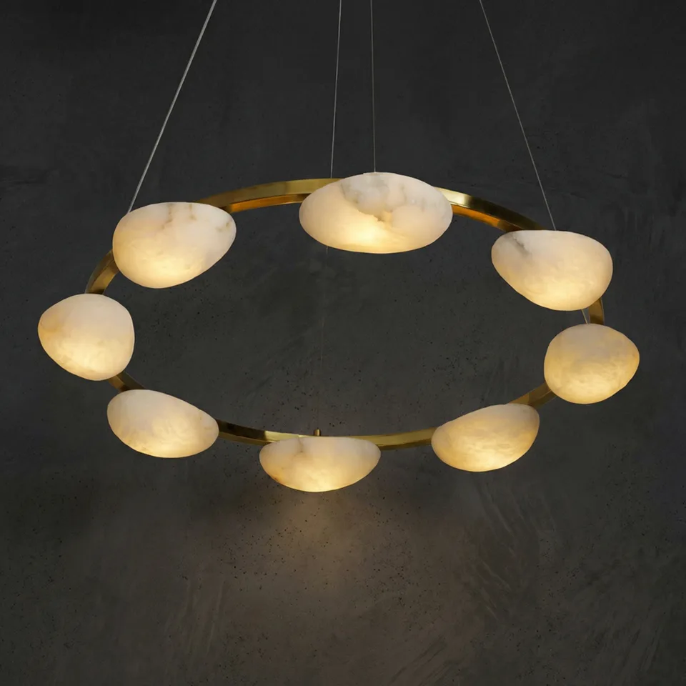 Alabaster Pebble Ring Chandelier 2 Alabaster pebble ring chandelier lit, glowing against a dark wall