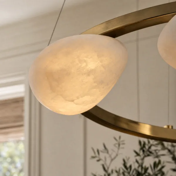 Natural alabaster pebble close-up on the brass ring chandelier