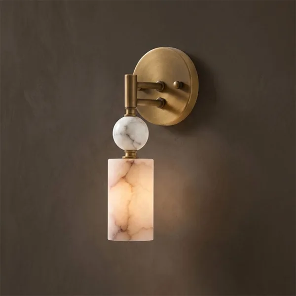 Alabaster ball and cylinder wall hanging light on a dark brown wall
