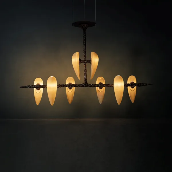 Eight-alabaster teardrop chandelier glowing warm in a dark room