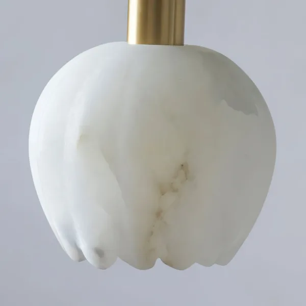 Close-up of a white veined alabaster shade from the alabaster tulip chandelier