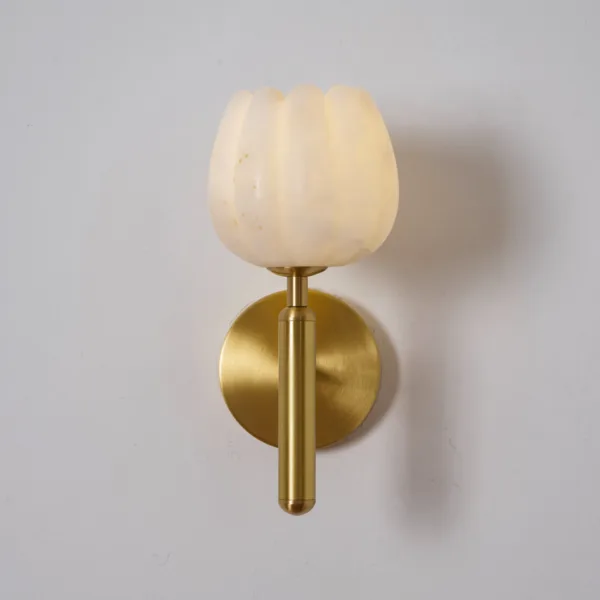 Front view of the alabaster tulip wall light, unlit, on its brass-finish stem and round backplate