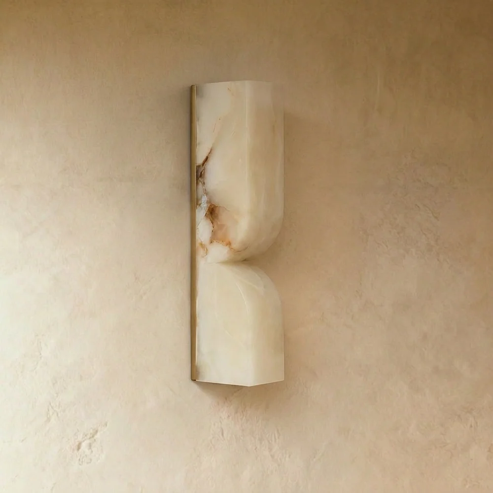 Alabaster Up and Down Wall Light – Carved Natural-Stone Sconce, 35 cm 3 Alabaster wall light unlit on a plaster wall, showing the carved scoops, natural veining and gold-finish edge
