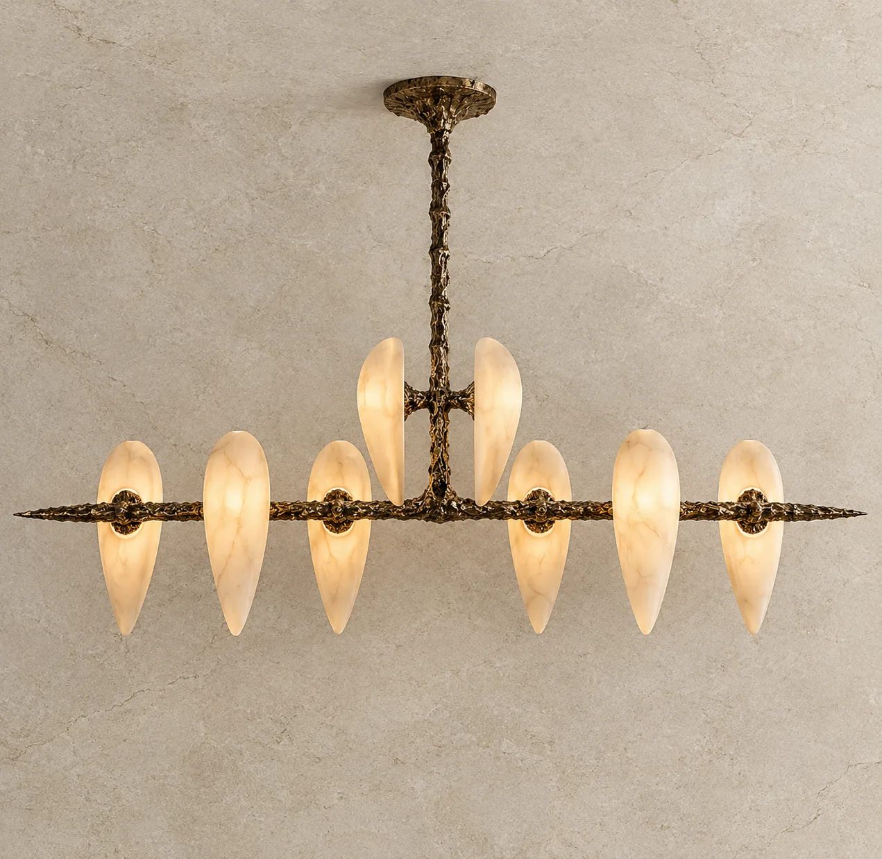 Alabaster teardrop chandelier with eight glowing veined alabaster drops on a textured cast gold-bronze frame